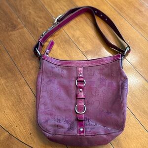 Genuine Coach G0973-F14036 purse in magenta Coach carriage print.
